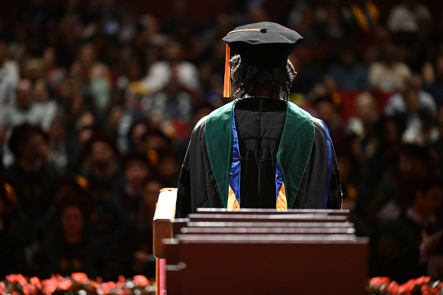 Graduate giving speech at commencement.