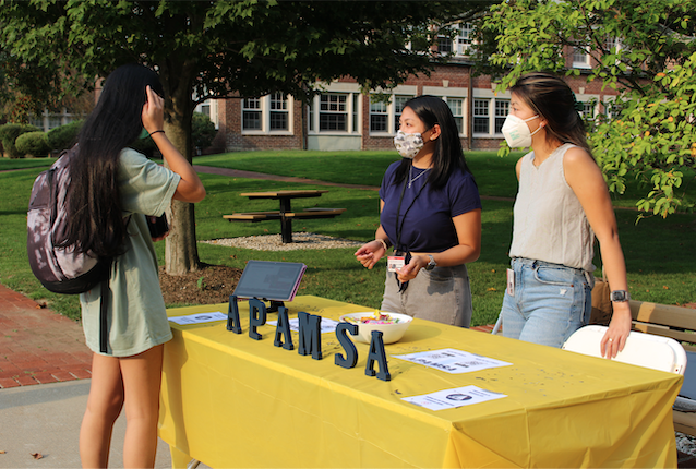 Students talking at APAMSA table at Annual Club Fair 2021