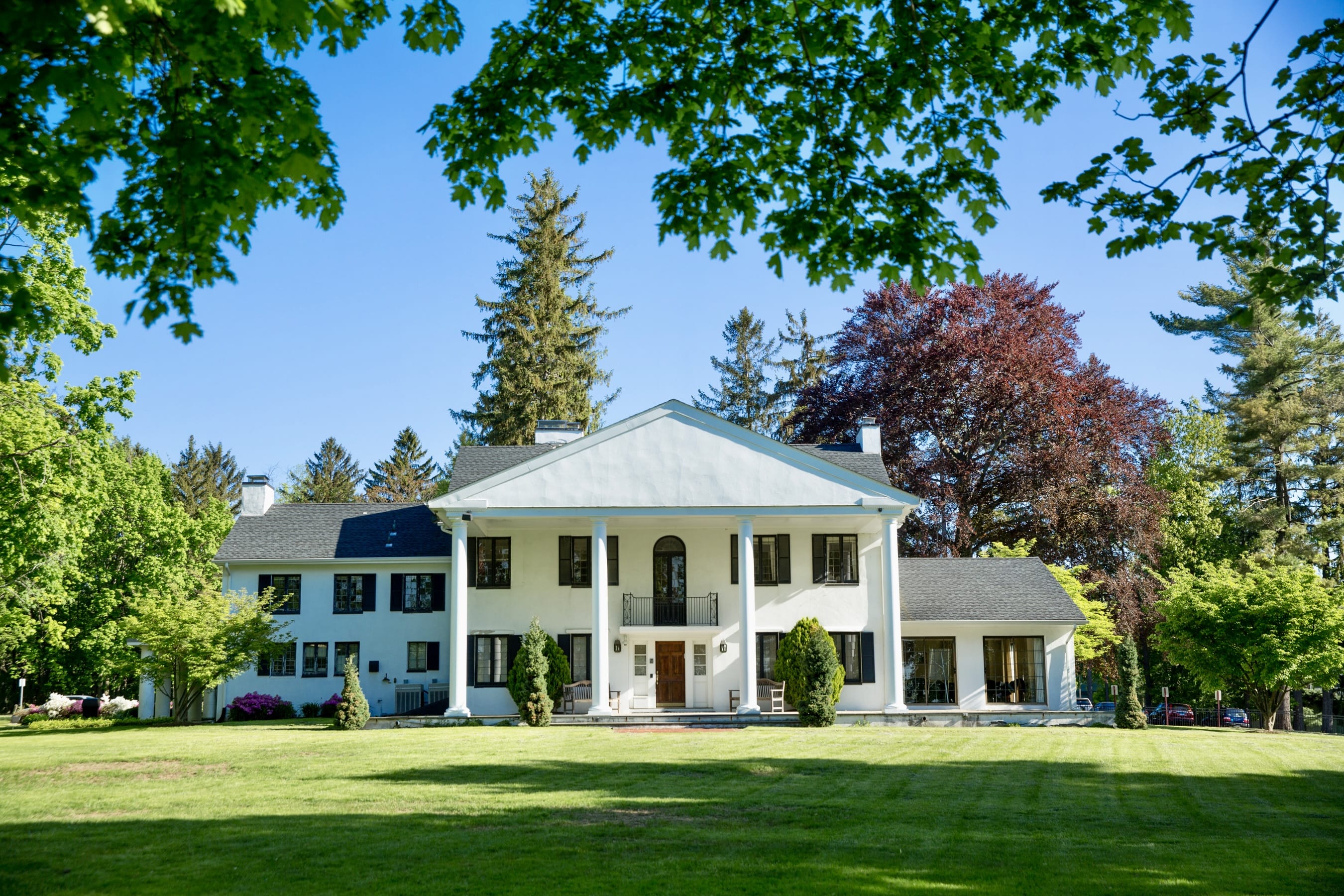 alumni house - a white house in the greek revival style