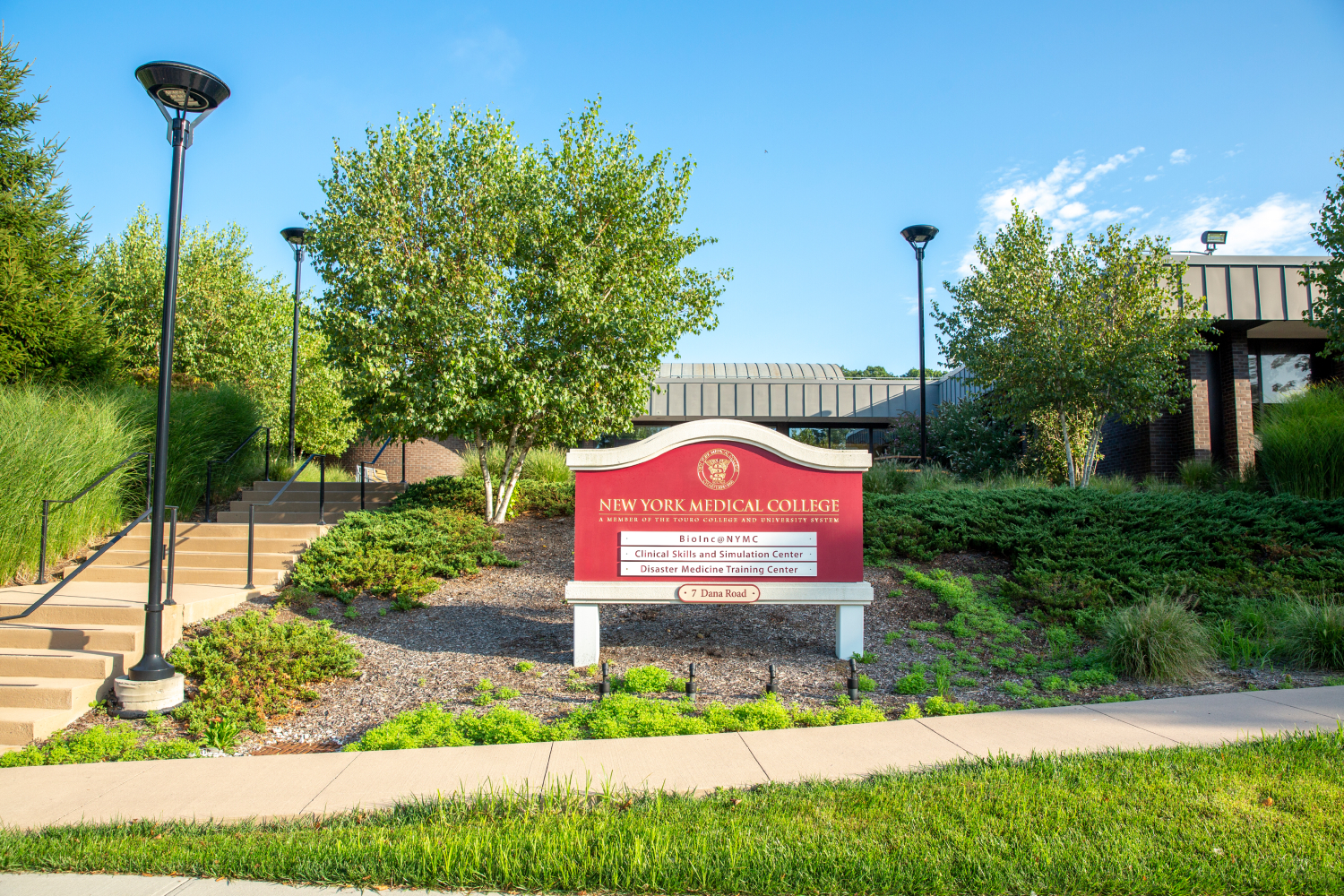 Sign on campus listing BioInc@NYMC, the Clinical Skills and Simulation Center, and the Disaster Medicine Training Center