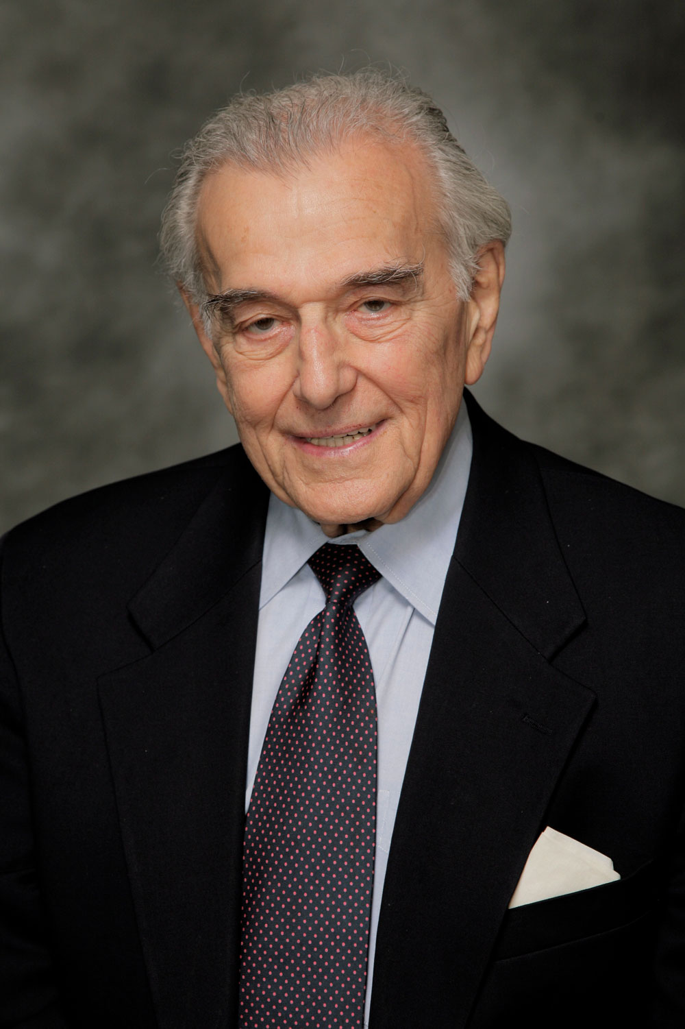 Gabor Kaley. He is smiling, has gray hair, dark eyebrows, and is wearing a suit.