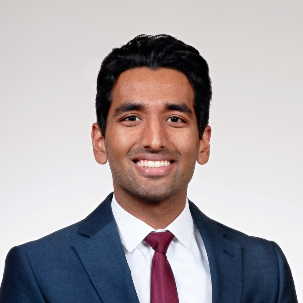 Headshot of Hussain Rao smiling.