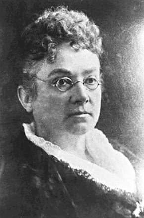 Dr. Emily Stowe. She has curly bangs and is wearing small, round glasses.