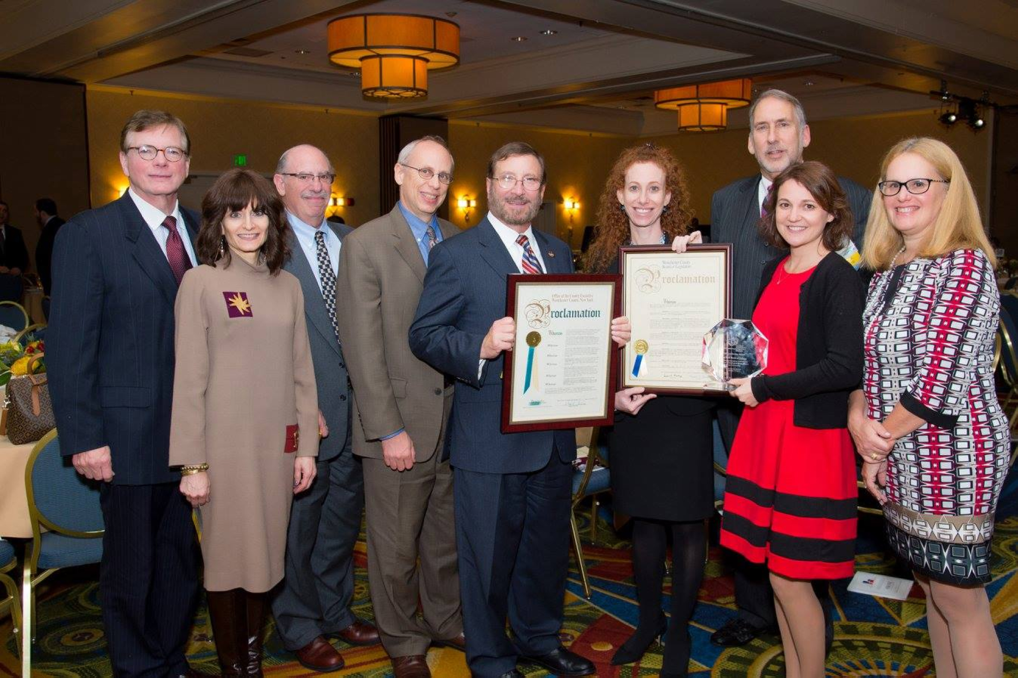 NYMC faculty and administration posing with awards from WCA at the WCA Annual Fall Leadership Dinner