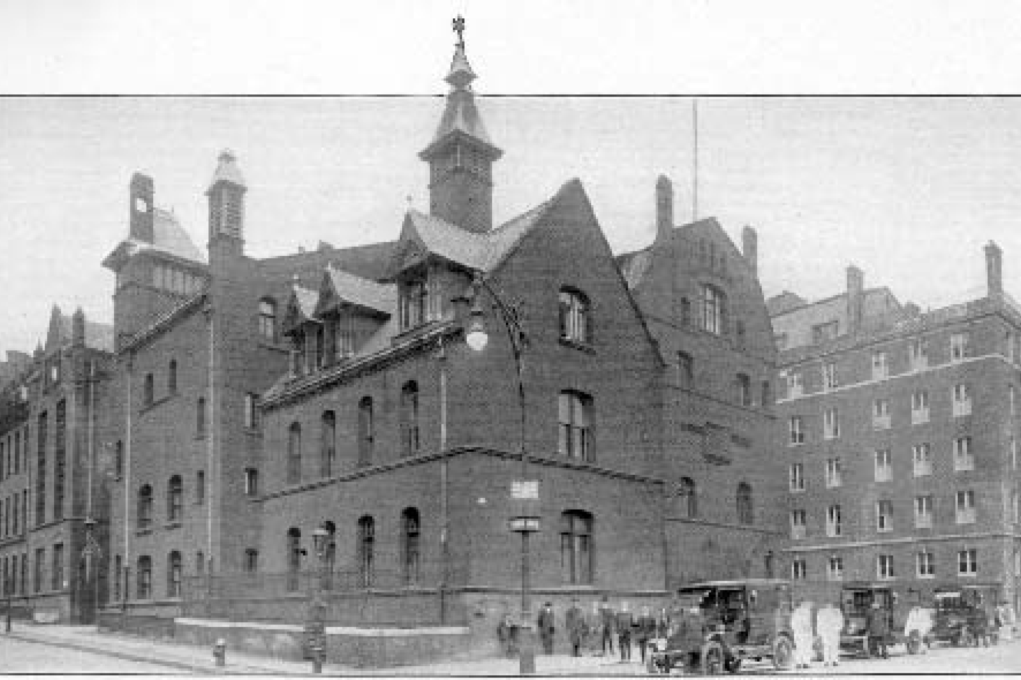 The Flower Free Surgical Hospital, a large brick building with small towers on it