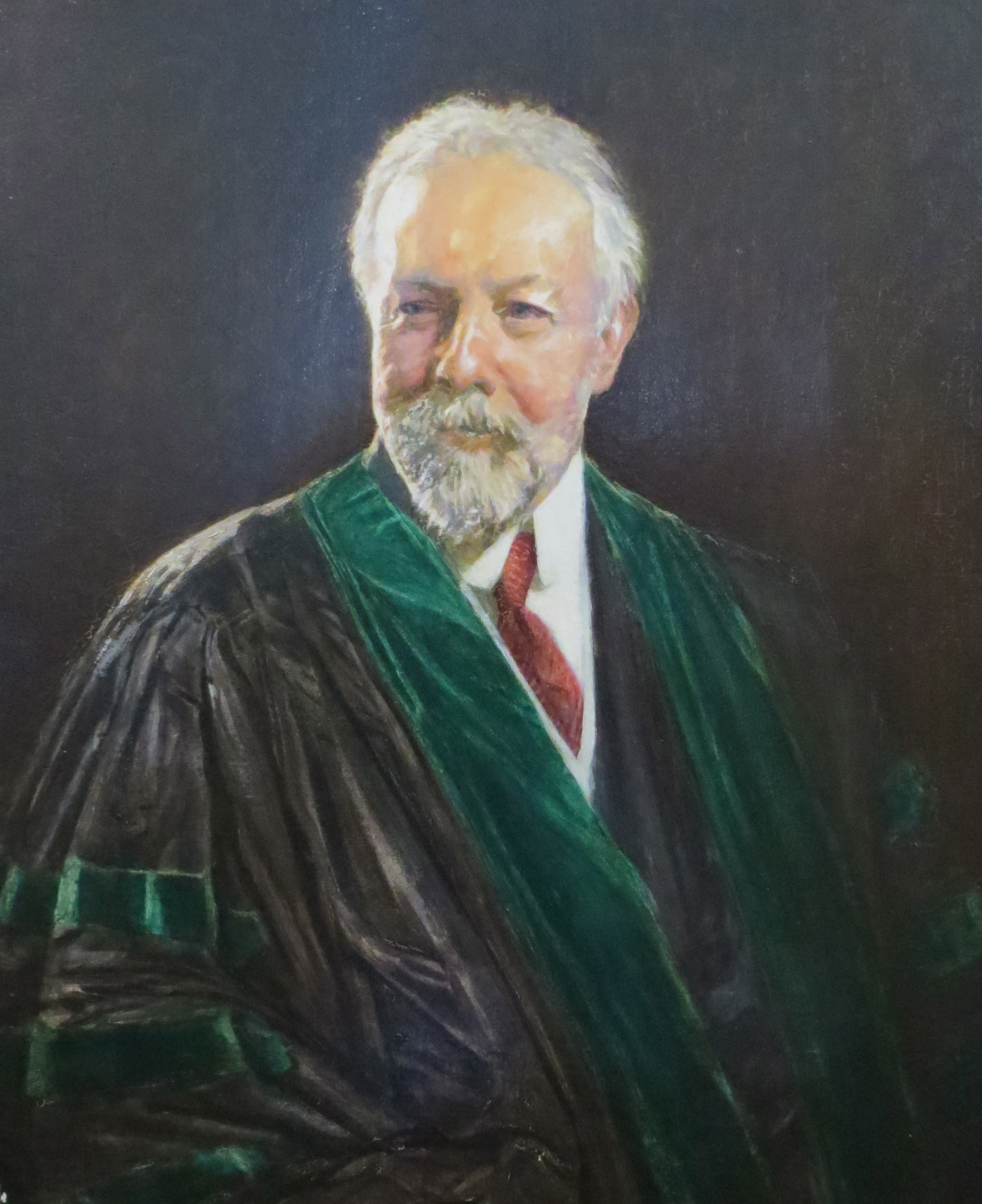 Oil painting of distinguished looking Walter Gray Crump. He is an elderly white man with white hair and beard, wearing a graduation gown.