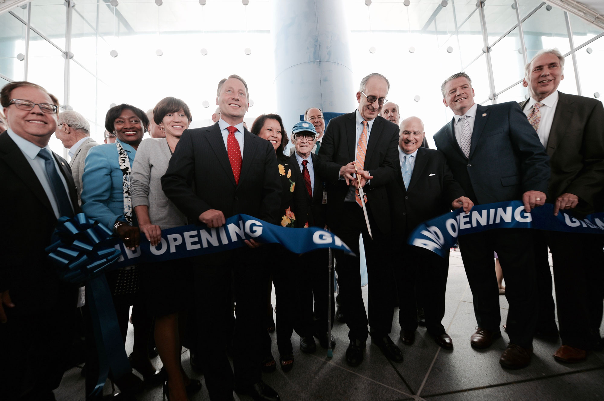 NYMC and touro administration cutting ribbon at ceremony