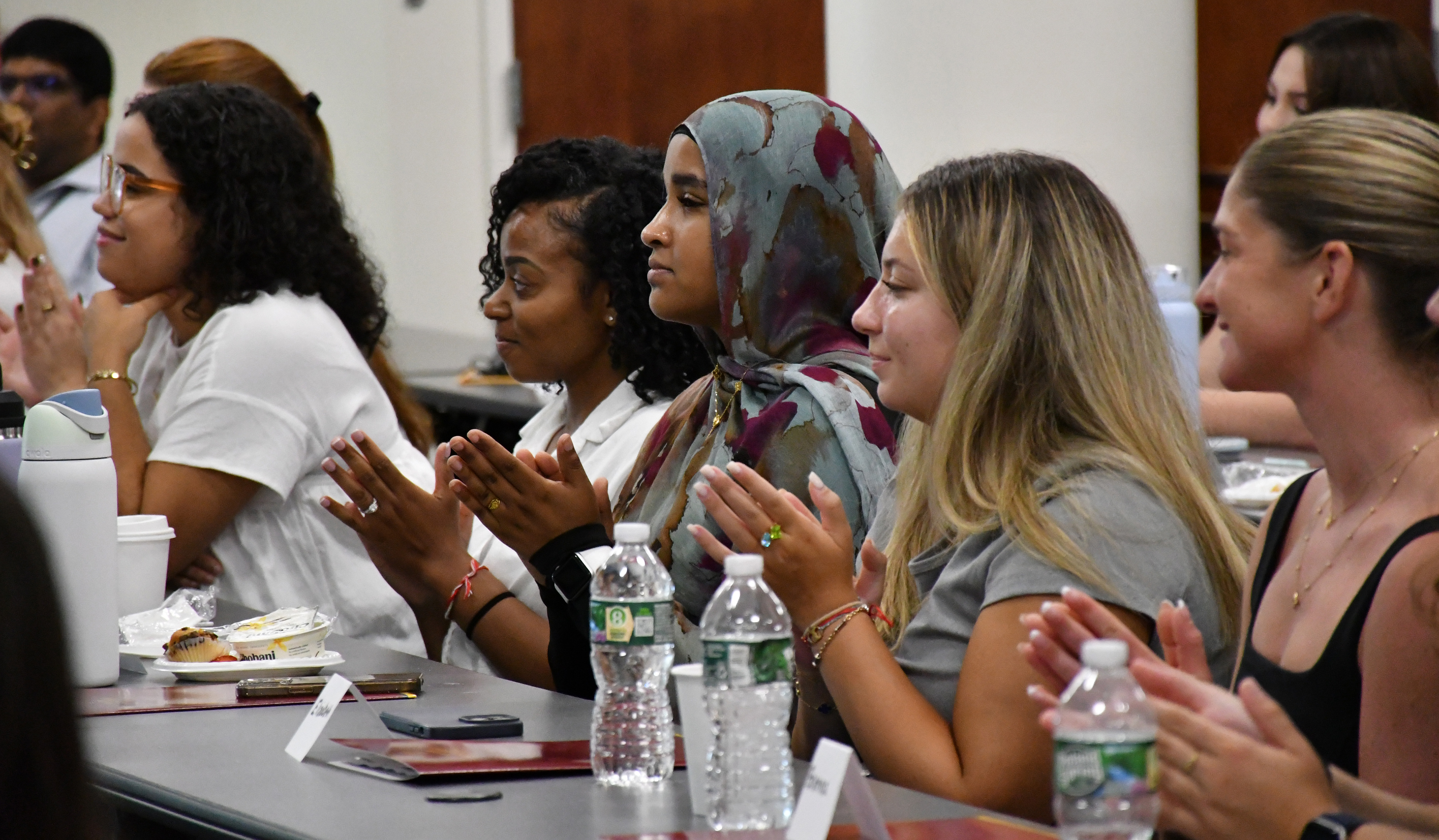 Students sitting at a table at the 2024 NYMC SHSP Orientation