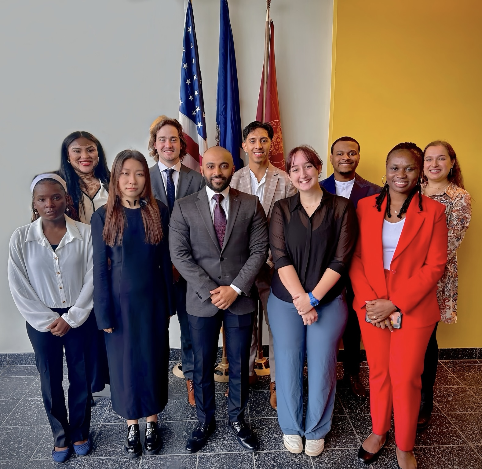 The New York Medical College Graduate Student Association e-board standing in formal wear in the Medical Education Center.