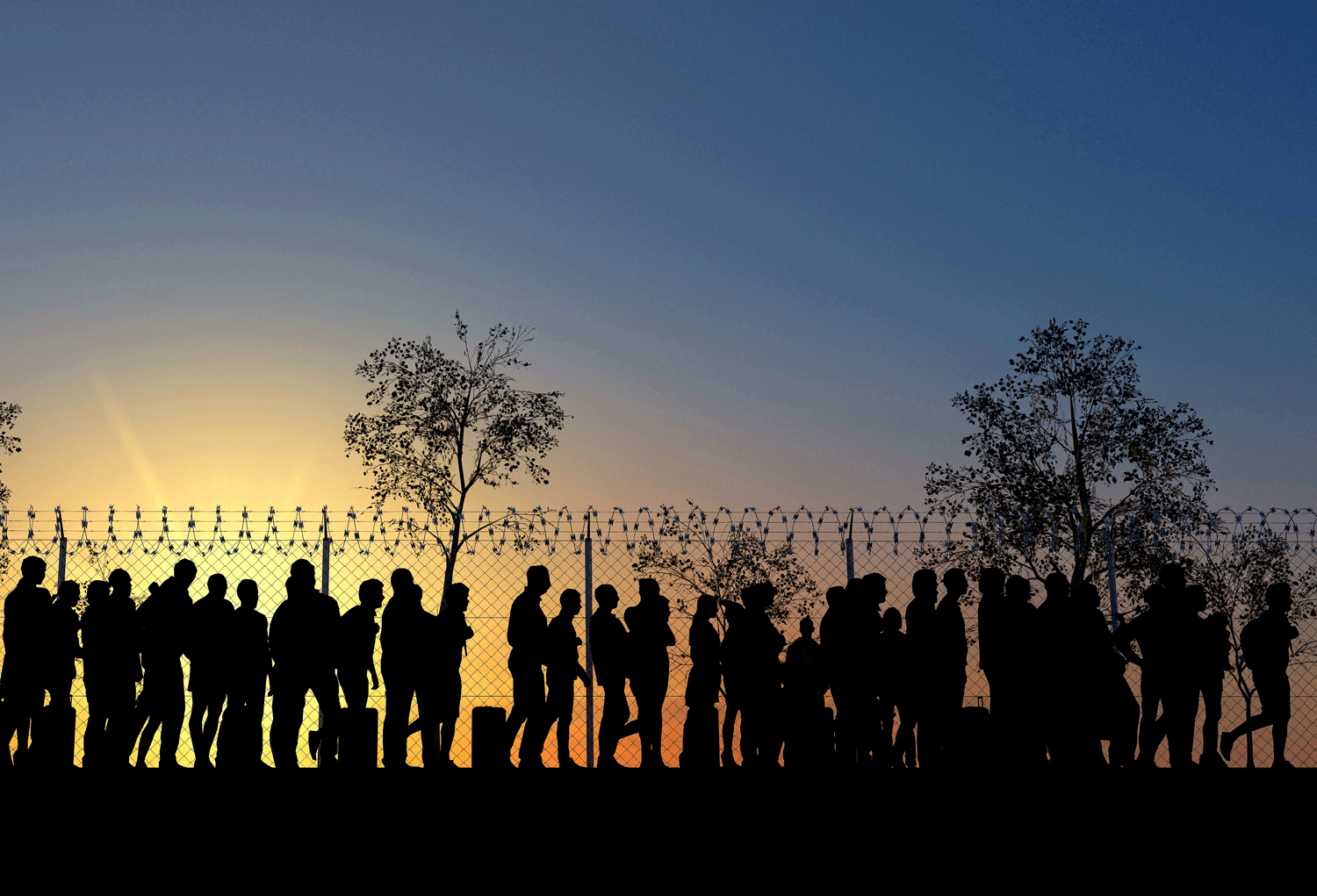 asylum seeking standing in line near the fence at sunrise