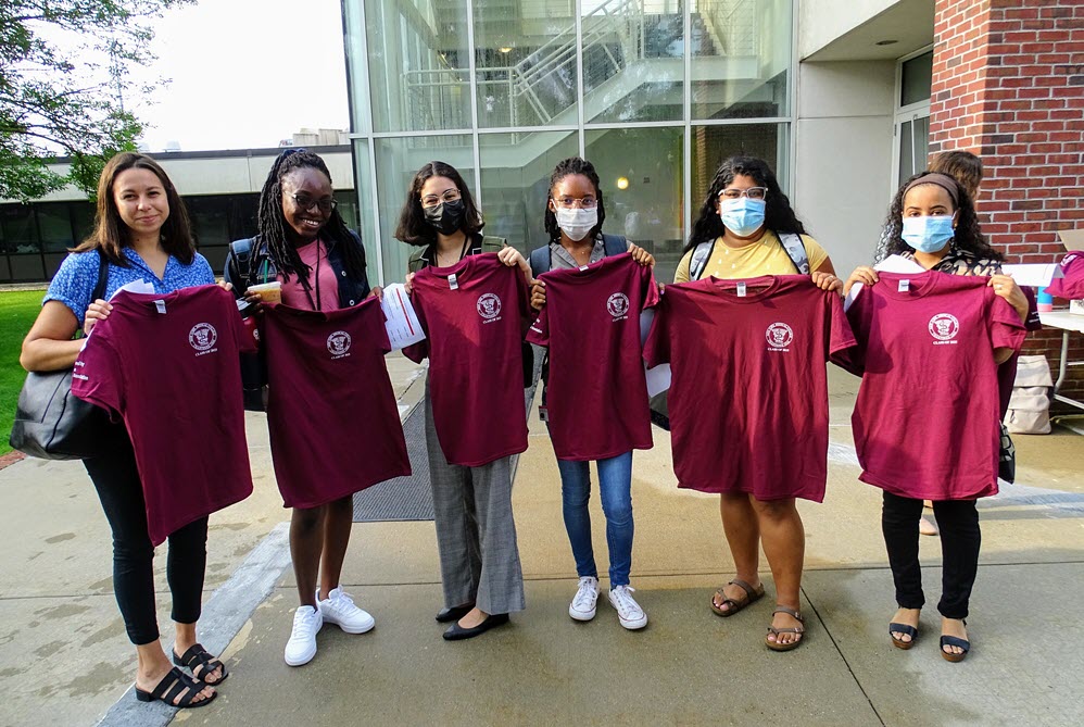 Six SOM Class of 2025 Students showing off their new class shirts during Transition to Medical School Week Group Headshot