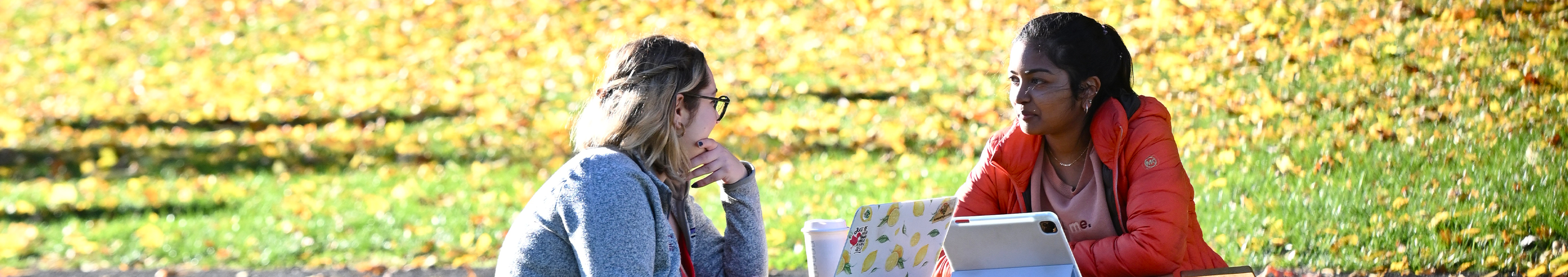 SHSP students sit outside on campus