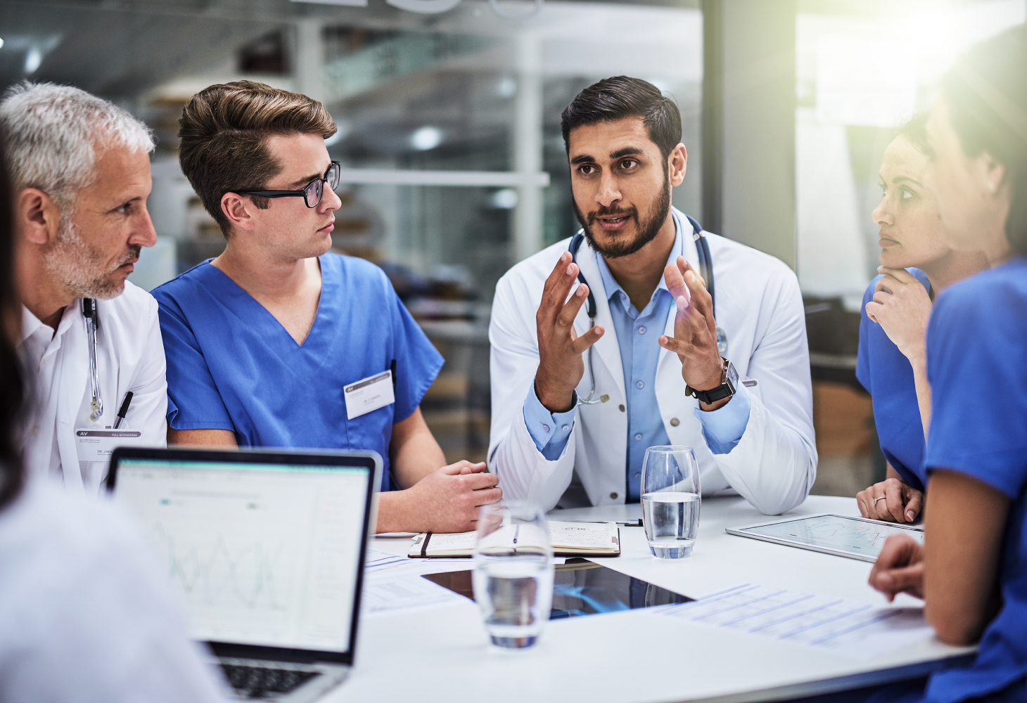 Medical students having a discussion at a table.