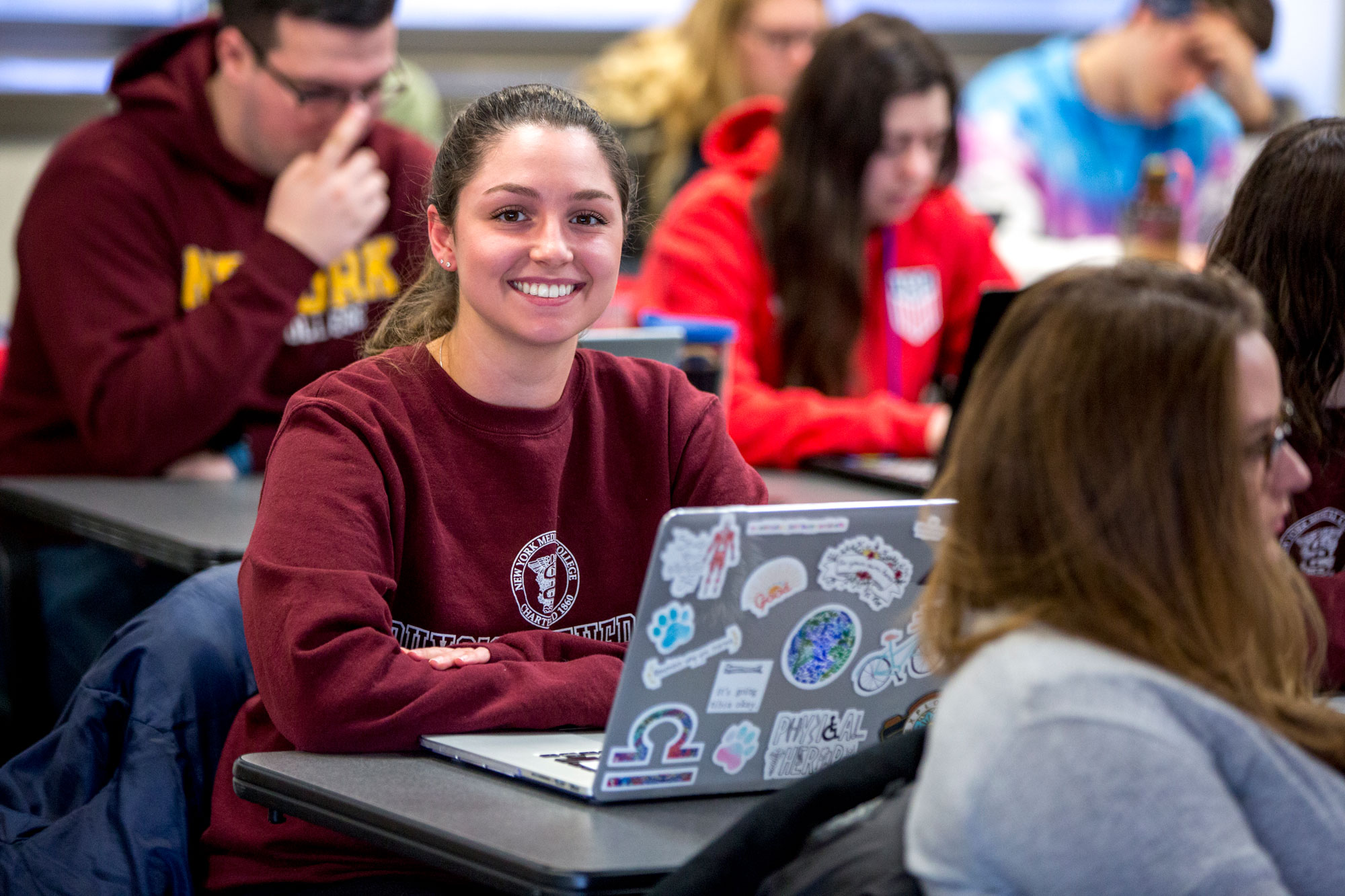 PT student smiling in lecture hall