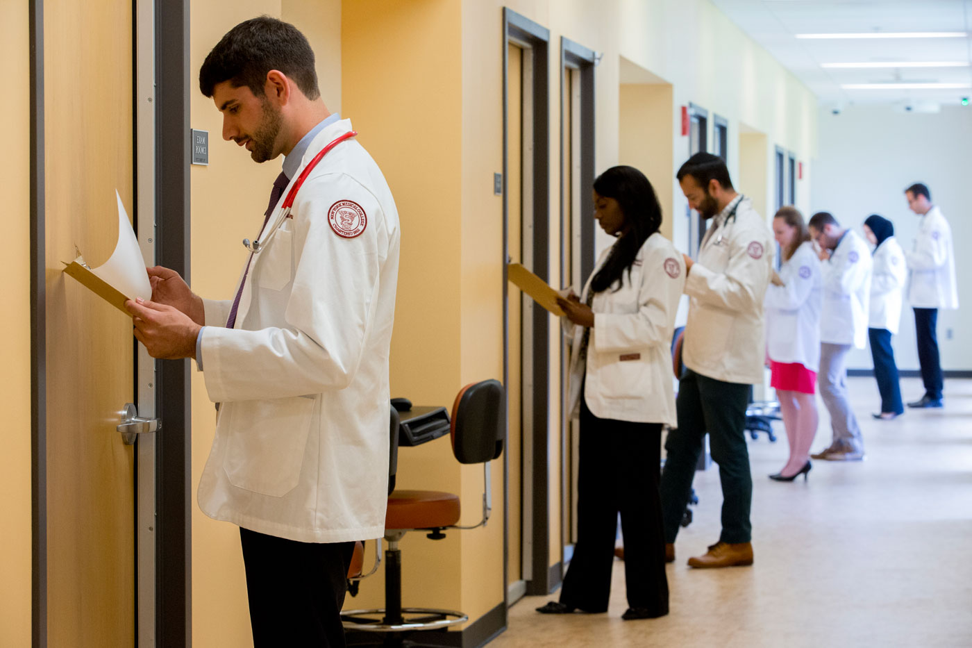 SOM students in hospital hallway