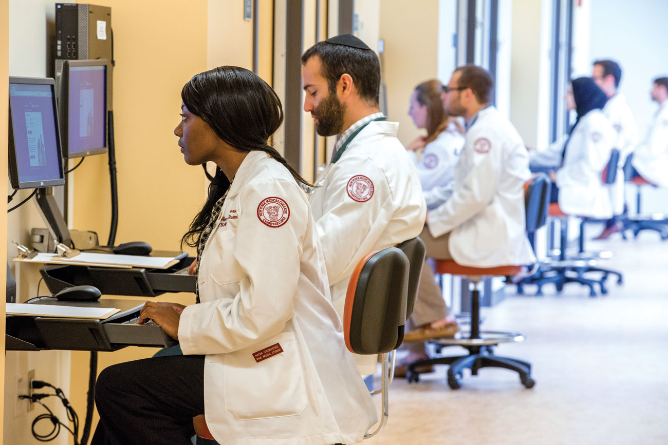 NYMC students using computers in hospital